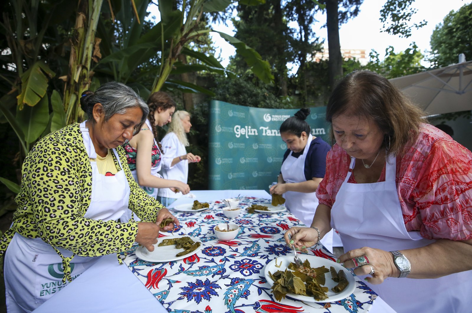 Argentines learn how to make traditional stuffed vine leaves at a workshop on Turkish cuisine in Buenos Aires, Argentina, Dec. 21, 2022. (AA Photo)