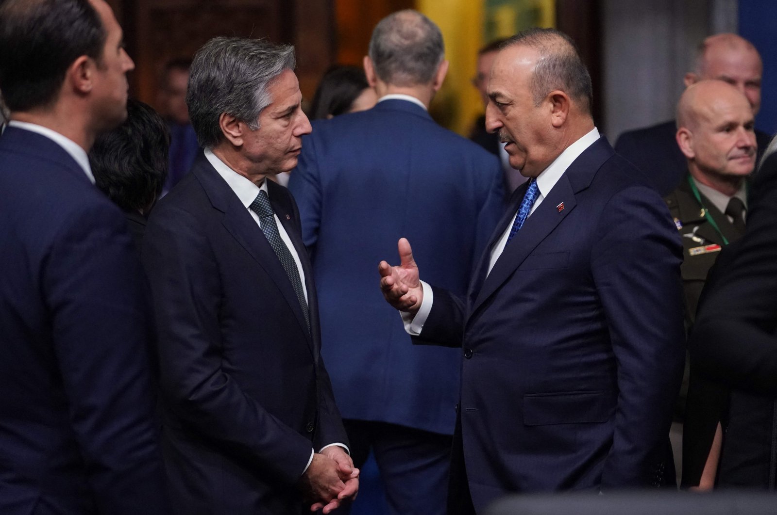 Foreign Minister Mevlüt Çavuşoğlu (R) and U.S. Secretary of State Antony Blinken (L) talk ahead of a meeting of NATO Foreign Ministers in Bucharest, Romania, Nov. 29, 2022. (AFP Photo)