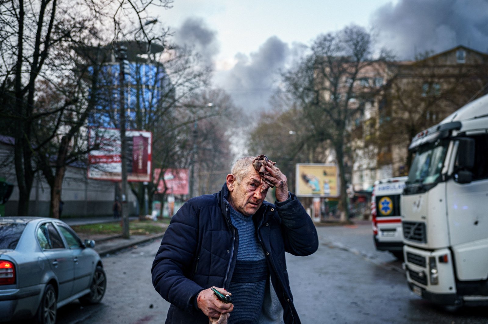 An injured man stands on a street after Russian shelling to Ukrainian city of Kherson, Ukraine, Dec. 24, 2022. (AFP Photo)