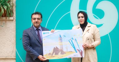 Yara Semir, an Egyptian student who won a round-trip ticket from Cairo to Türkiye in Yunus Emre Institute's online "Meet Turkish" contest, accepts her award, Egypt, Dec. 22, 2022. (AA Photo)