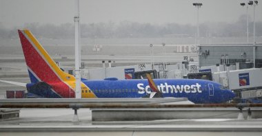 A plane sits on the airfield as flight cancellations mount during a cold weather front as a weather phenomenon known as a bomb cyclone hits the Upper Midwest, at Midway International Airport in Chicago, Illinois, U.S., Dec. 22, 2022. (Reuters Photo)