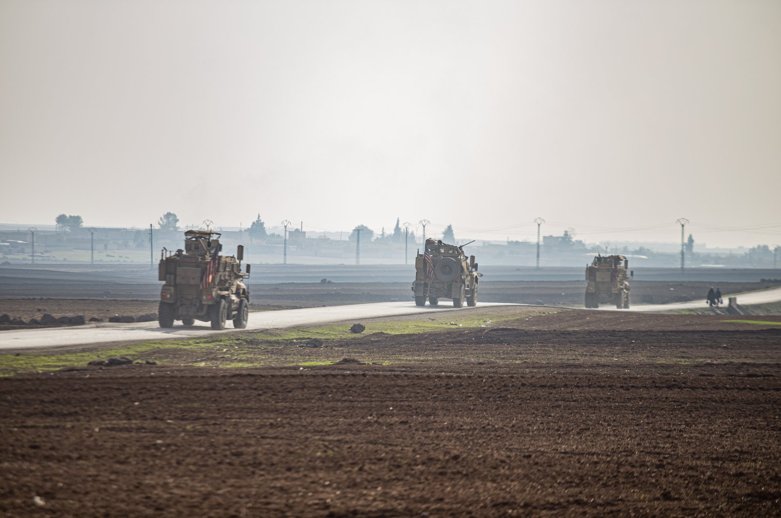 U.S. military vehicles patrol the countryside near the town of Qamishli, Syria, Dec. 4, 2022. (AP Photo)