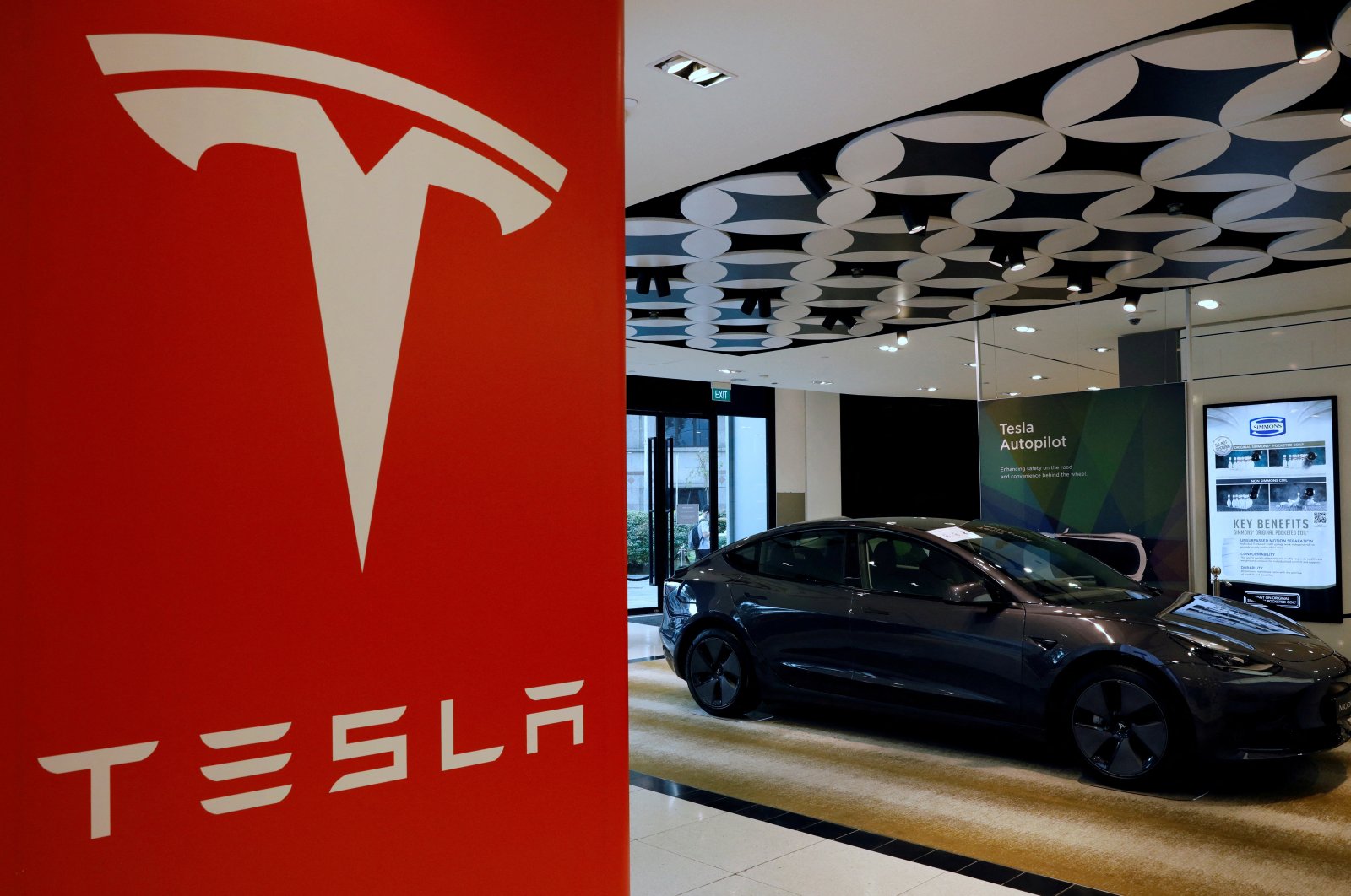 A Tesla model 3 car is seen in their showroom in Singapore, Oct. 22, 2021. (Reuters Photo)