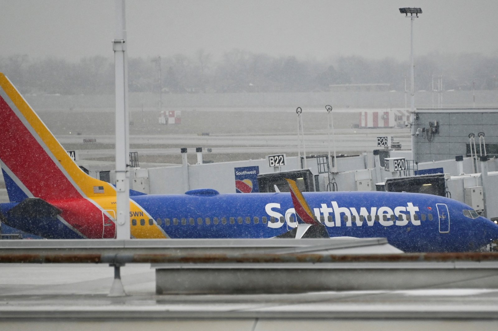 A plane sits on the airfield as flight cancellations mount during a cold weather front as a weather phenomenon known as a bomb cyclone hits the Upper Midwest, at Midway International Airport in Chicago, Illinois, U.S., Dec. 22, 2022. (Reuters Photo)