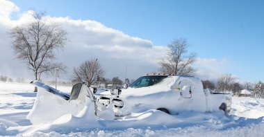 A snow plow is left stranded on the road following a winter storm, Amherst, New York, U.S., Dec. 25, 2022. (Reuters Photo)