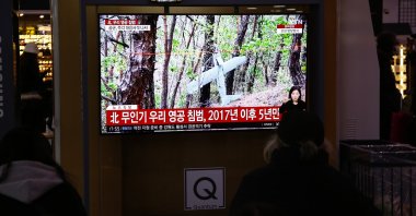 People watch the news showing file footage of a suspected North Korean UAV at a station in Seoul, South Korea, Dec. 26, 2022. (EPA Photo)