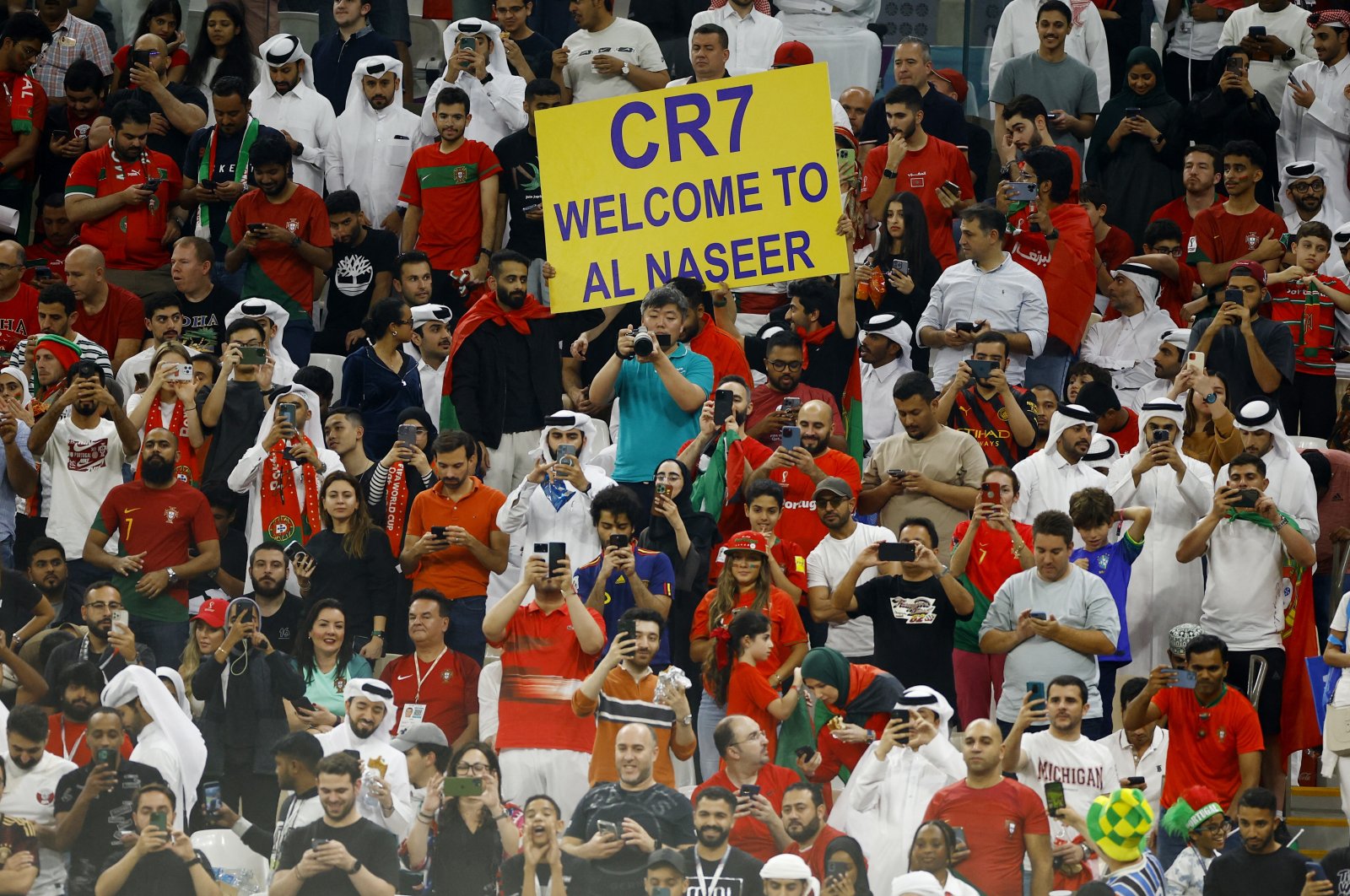 Fans hold up a sign inside the stadium with a message welcoming Cristiano Ronaldo to Al Nassr due to his prospective transfer to the Lusail Stadium, Lusail, Qatar, Dec. 6, 2022. (Reuters Photo)
