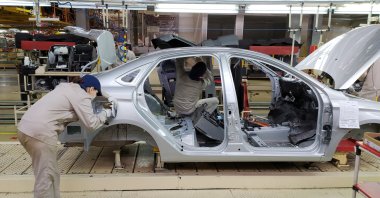 Employees work at the assembly line of the LADA Izhevsk automobile plant, part of the Avtovaz Group, in Izhevsk, Russia, Feb. 22, 2022. (Reuters Photo)