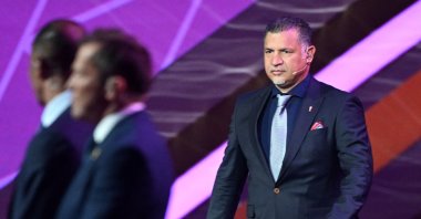 Former Iranian footballer Ali Daei arrives on stage during the draw for the 2022 World Cup at the Doha Exhibition and Convention Center, Doha, Qatar, April 1, 2022. (AFP Photo)