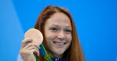 Bronze medalist Aliaksandra Herasimenia of Belarus poses on the podium during the medal ceremony for the Women's 50m Freestyle Final on Day 8 of the Rio 2016 Olympic Games at the Olympic Aquatics Stadium. Rio de Janeiro, Brazil, Aug. 13, 2016. (Getty Images Photo)