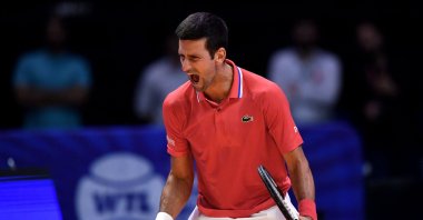 Serbia's Novak Djokovic celebrates defeating Austria's Sebastian Ofner during the 2022 World Tennis League exhibition match at Dubai Coca-Cola arena, United Arab Emirates, Dec. 23, 2022. (AFP Photo)