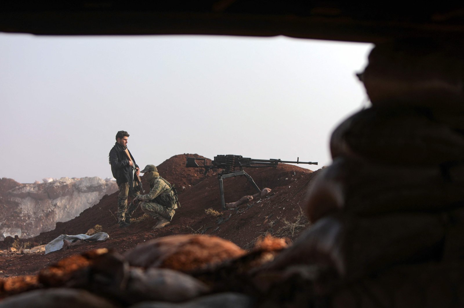 Turkey-backed Syrian fighters man positions on the outskirts of the town of Kuljibrin, in the country&#039;s northern Aleppo governorate, facing positions of the YPG-controlled area of Tal Rifaat, on December 2, 2022. (AFP Photo)