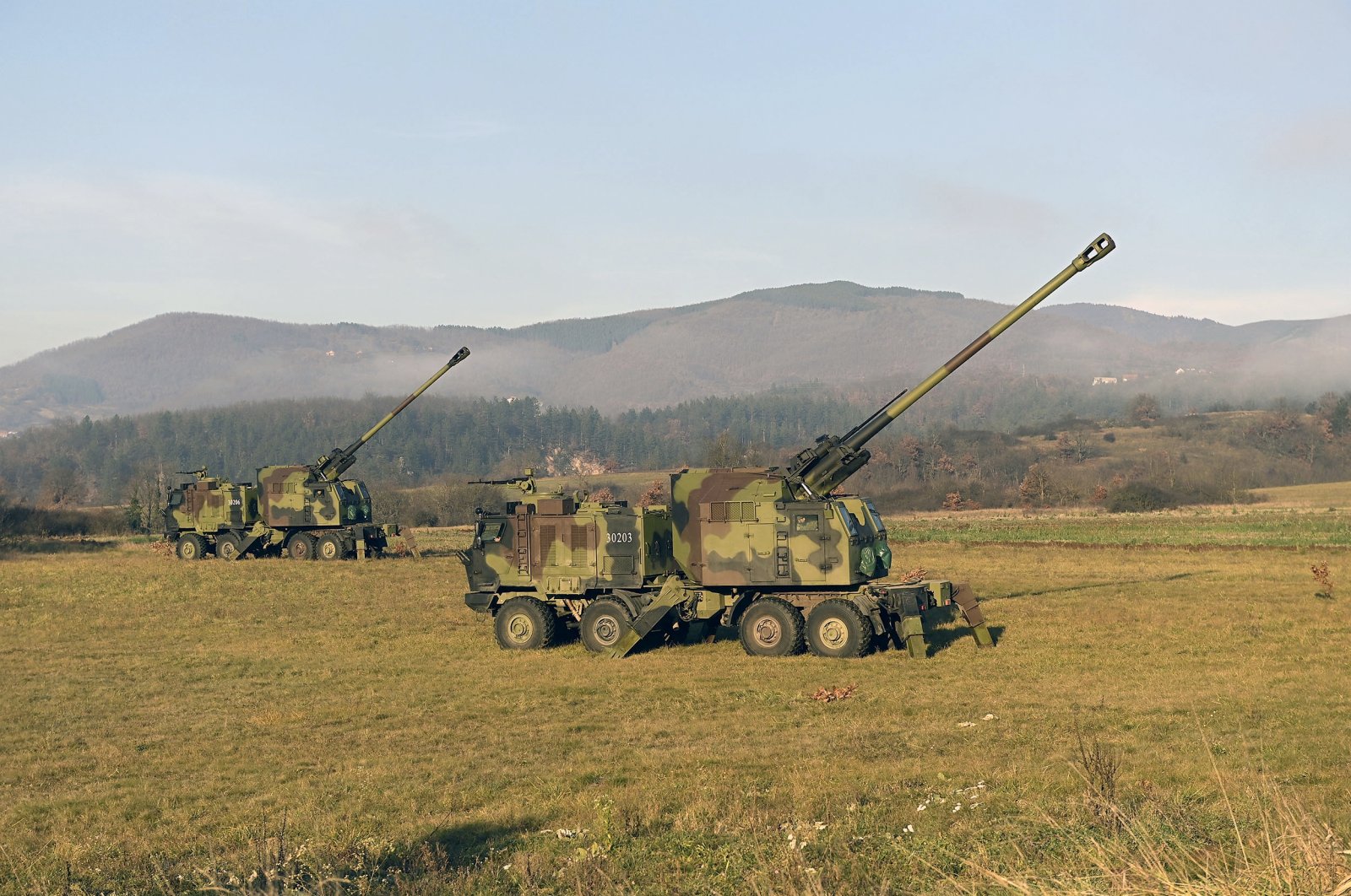 Serbian army self-propelled 155 mm gun-howitzers are seen on position near administrative line with Kosovo, south Serbia, Monday, Dec. 26, 2022. (AP Photo)