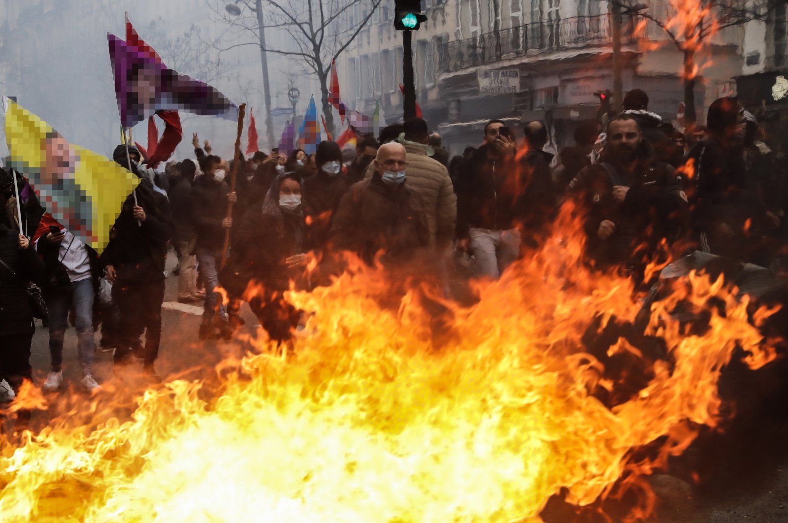 PKK supporters attack civilian cars and set streets on fire in Paris, France, Dec. 24, 2022. (EPA Photo)