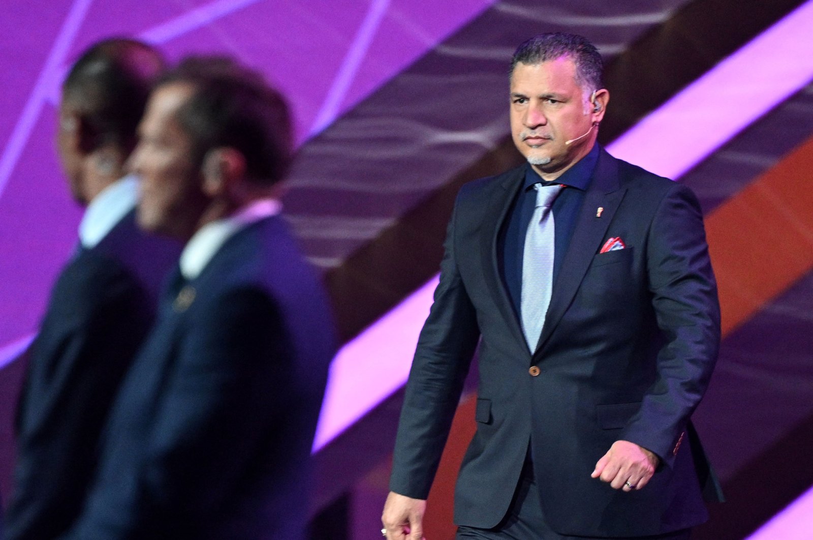 Former Iranian footballer Ali Daei arrives on stage during the draw for the 2022 World Cup at the Doha Exhibition and Convention Center, Doha, Qatar, April 1, 2022. (AFP Photo)
