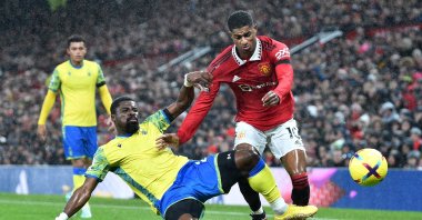 Marcus Rashford (R) in action against Serge Aurier during an EPL match between Manchester United and Nottingham Forest, Manchester, UK, Dec. 27 2022. (EPA Photo)