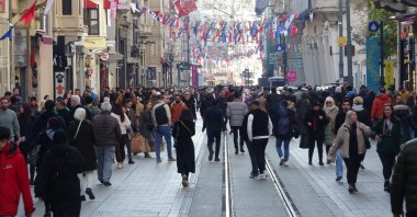 People walking on Istiklal Street, in Istanbul, Türkiye, Dec. 28, 2022. (IHA Photo)