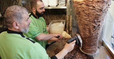 Workers prepare a kebab at the Imren Grill döner shop, in Berlin, Germany, March 19, 2022. (dpa Photo)