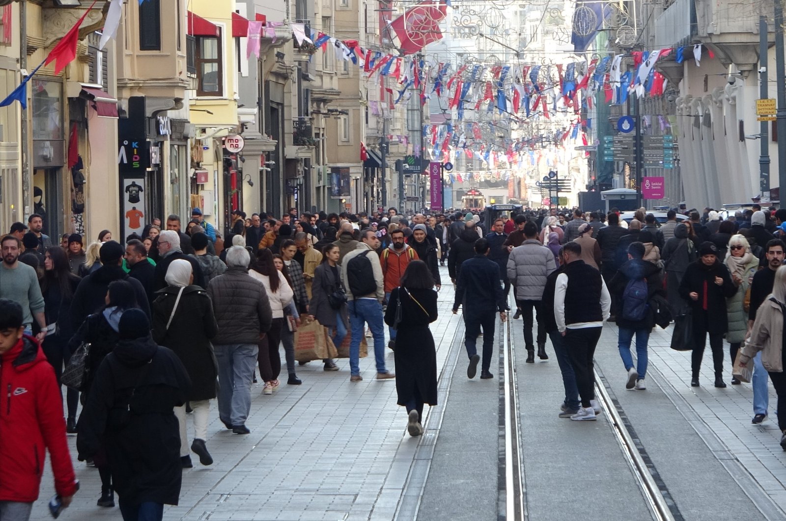 People walking on Istiklal Street, in Istanbul, Türkiye, Dec. 28, 2022. (IHA Photo)
