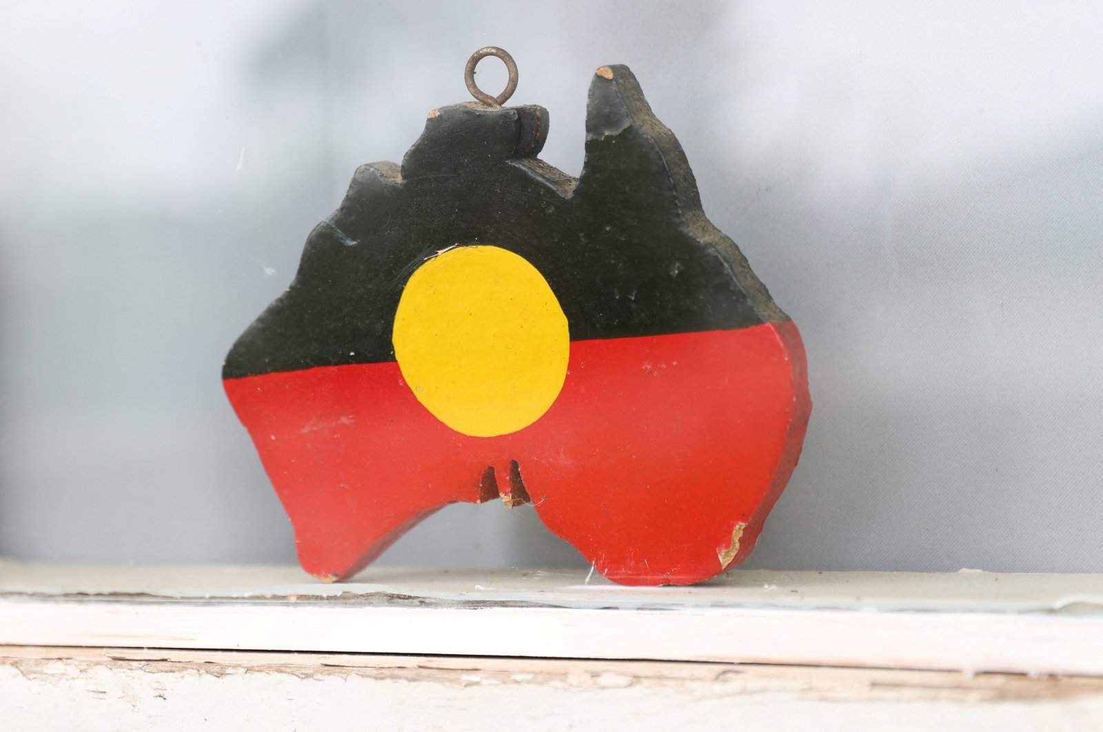 A depiction of the Australian Aboriginal Flag is seen on a window sill at the home of indigenous Muruwari elder Rita Wright, Sydney, Australia, Jan. 19, 2021. (Reuters Photo)
