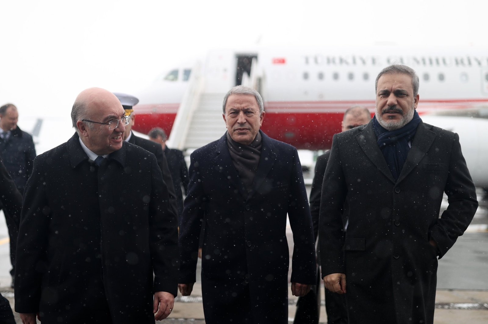 Defense Minister Hulusi Akar (C) and National Intelligence Organization head Hakan Fidan (R) arrive at Esenboğa Airport, Ankara, Türkiye, Dec. 28, 2022. (DHA Photo)