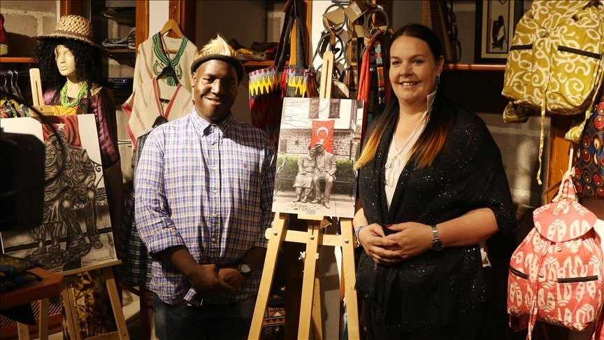 Marion Smith (R) and Alex Maswanganyi (L) from South Africa pose with their exhibition work in the capital Ankara, Türkiye, Oct. 21, 2022. (AA Photo)