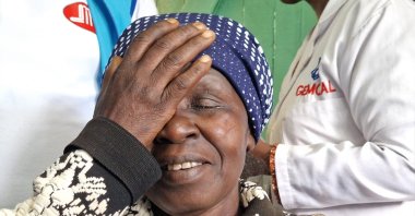 An African woman shares a smile after her successful surgery sponsored by the DITIB, Dec. 30, 2022. (AA Photo)