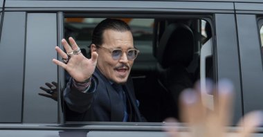 Actor Johnny Depp waves to supporters as he departs the Fairfax County Courthouse during his high-profile libel lawsuit against ex-wife Amber Heard, Virginia, U.S., May 27, 2022. (AP Photo)