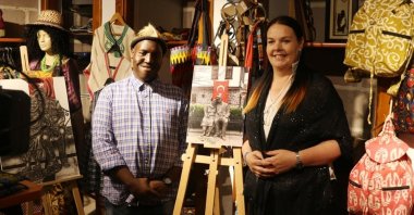 Marion Smith (R) and Alex Maswanganyi (L) from South Africa pose with their exhibition work in the capital Ankara, Türkiye, Oct. 21, 2022. (AA Photo)