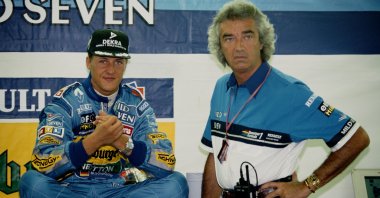 Germany&#039;s Michael Schumacher (L) of the #1 Mild Seven Benetton Ford Benetton B195 Renault V10 talking with team director Flavio Briatore (R) during practice for the Italian Grand Prix at the Autodromo Nazionale Monza. Monza, Italy, Sept. 10 1995. (Getty Images Photo)