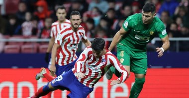 Atletico Madrid's Spanish forward Alvaro Morata (L) falls next to Elche's Spanish defender Diego Gonzalez (R) during the Spanish League football match between Club Atletico de Madrid and Elche CF at the Wanda Metropolitano stadium, Madrid, Spain, Dec. 29, 2022. (AFP Photo)