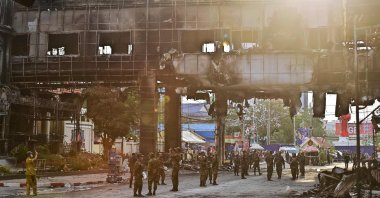 Cambodian soldiers patrol the destroyed part of the Grand Diamond City hotel-casino after a fire, Poipet, Cambodia, Dec. 30, 2022. (AFP Photo)
