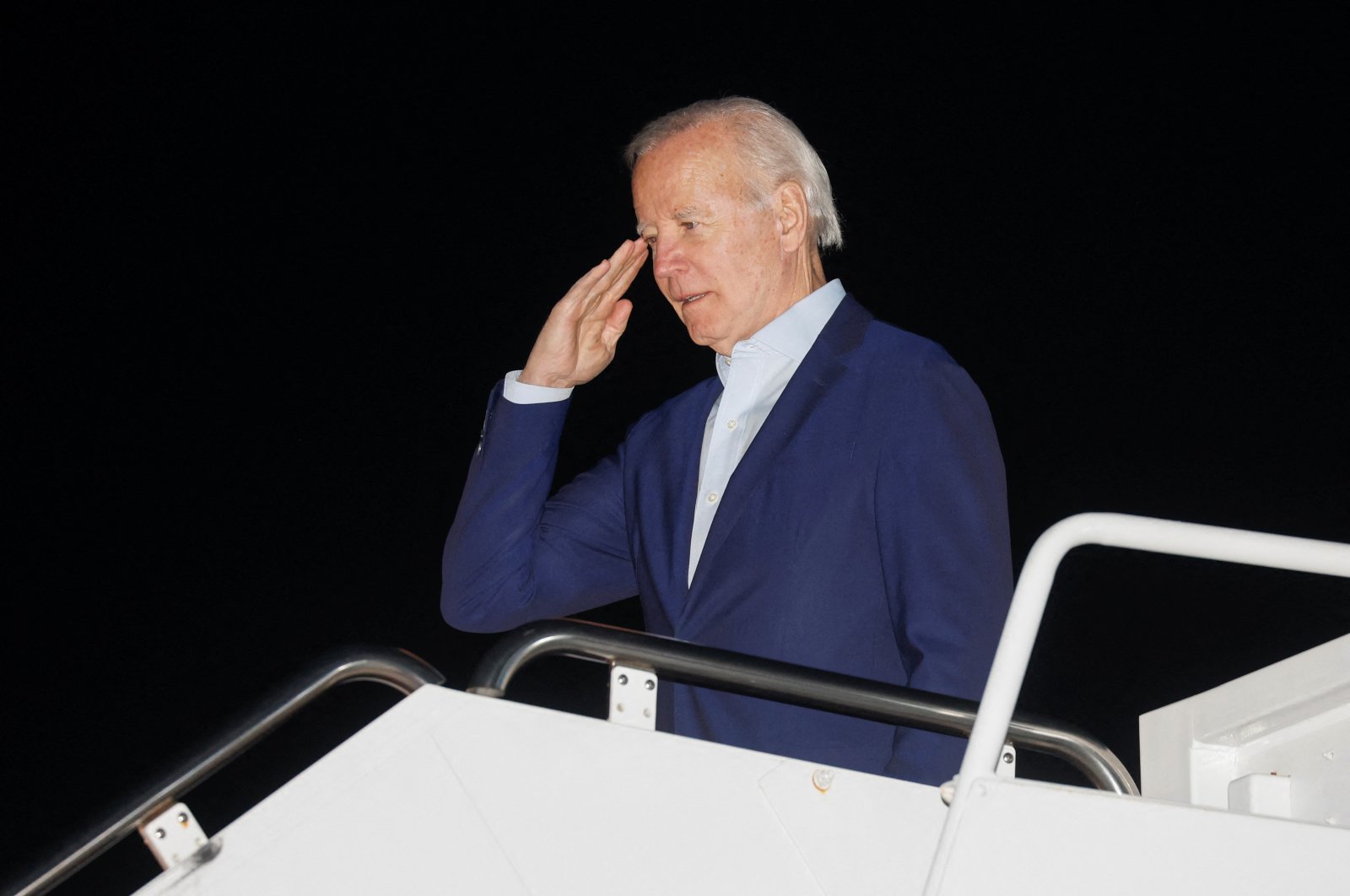 U.S. President Joe Biden salutes as he boards Air Force One for holiday vacation travel to St. Croix, U.S. Virgin Islands, from Joint Base Andrews, Maryland, U.S., Dec. 27, 2022. (Reuters Photo)
