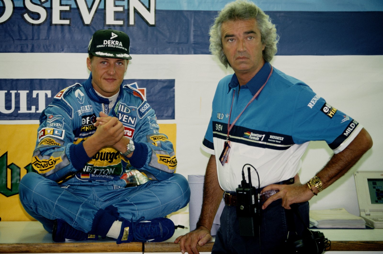 Germany&#039;s Michael Schumacher (L) of the #1 Mild Seven Benetton Ford Benetton B195 Renault V10 talking with team director Flavio Briatore (R) during practice for the Italian Grand Prix at the Autodromo Nazionale Monza. Monza, Italy, Sept. 10 1995. (Getty Images Photo)