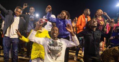 People celebrate after the countdown to the new year at Miracle Center Cathedral in Kampala, Uganda, Jan. 1, 2023. (AFP Photo)