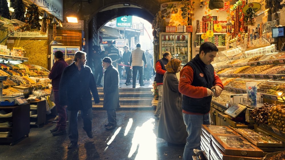 People walking and shopping inside the Spice Bazaar (Mısır Çarşısı) one of the largest bazaars located in the Eminönü quarter of Fatih district, Istanbul, Türkiye, Jan. 13, 2017. (Shutterstock Photo)