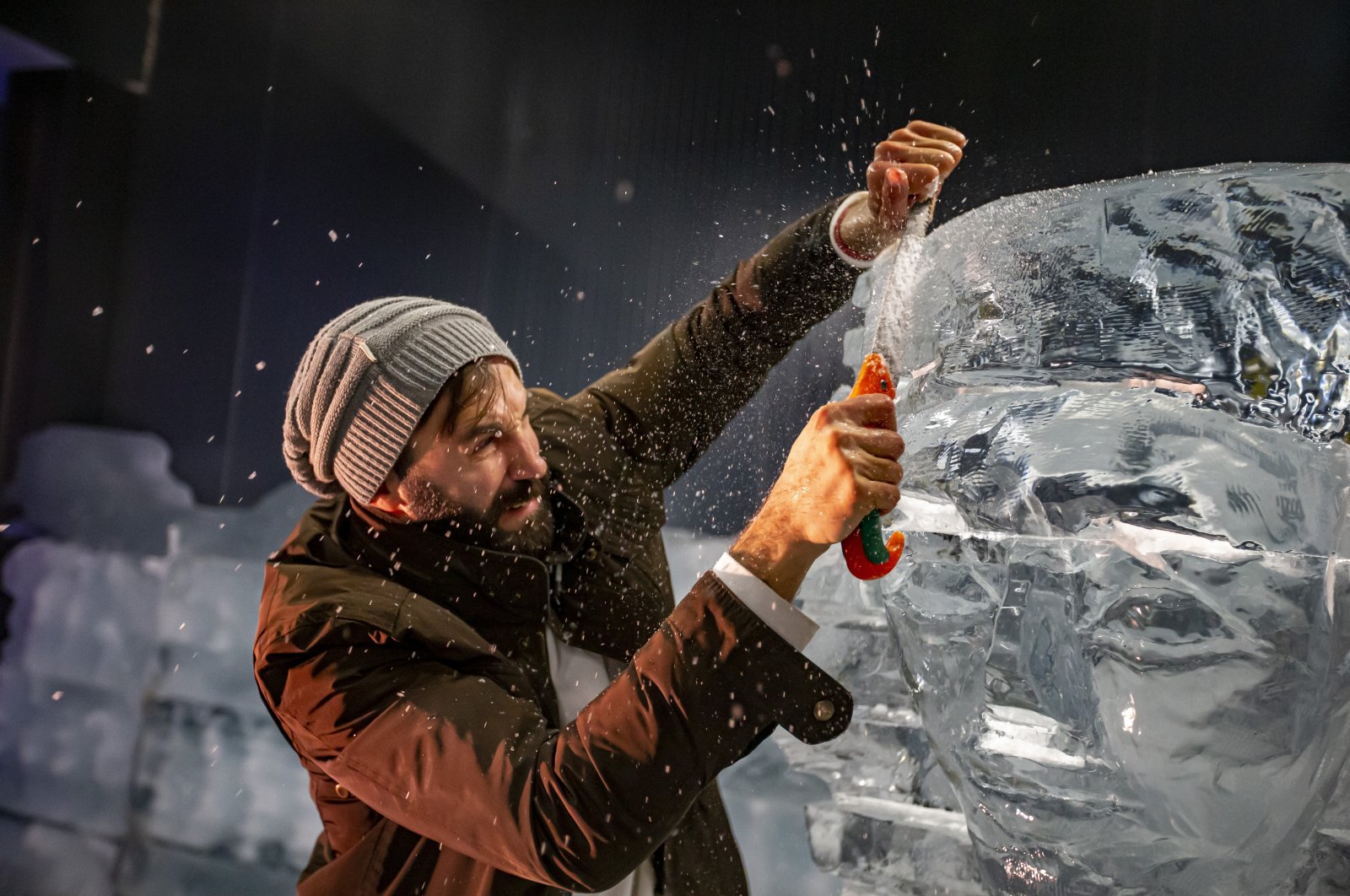 An artist works on the sphinx figure displayed in the ice museum, Erzurum, Türkiye, Dec. 28, 2022. (AA Photo)