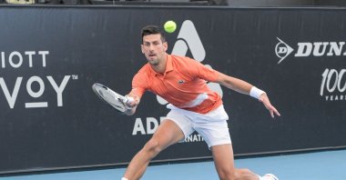 Serbian tennis player Novak Djokovic hits a return during his first-round match against France's Constant Lestienne at the ATP Adelaide International tournament, Adelaide, Australia, Jan. 3, 2023. (AFP Photo)
