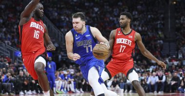 Dallas Mavericks guard Luka Doncic drives with the ball as Houston Rockets forward Usman Garuba defends during the third quarter at Toyota Center, Houston, Texas, U.S., Jan 2, 2023. (Reuters Photo)
