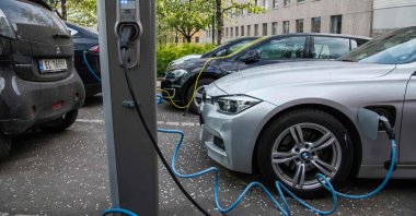 Electric cars are being charged in a street in Oslo, Norway, April 30, 2019. (AFP Photo)