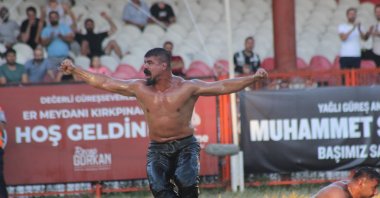 Cengizhan Şimşek in action during the 2022 Historical Kırkpınar Oil Wrestling competition, Kırkpınar, Edirne, Türkiye. (IHA Photo)