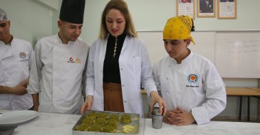 The students of the Şehit Karayılan Vacational and Tecnical Anatolian High School are pictured with their gastronomy teacher, Gaziantep, Türkiye, Jan. 3, 2023. (AA Photo)