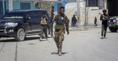 Somali security forces patrol the scene of a previous terrorist attack in Mogadishu, Somalia, Aug. 21, 2022. (AP Photo)