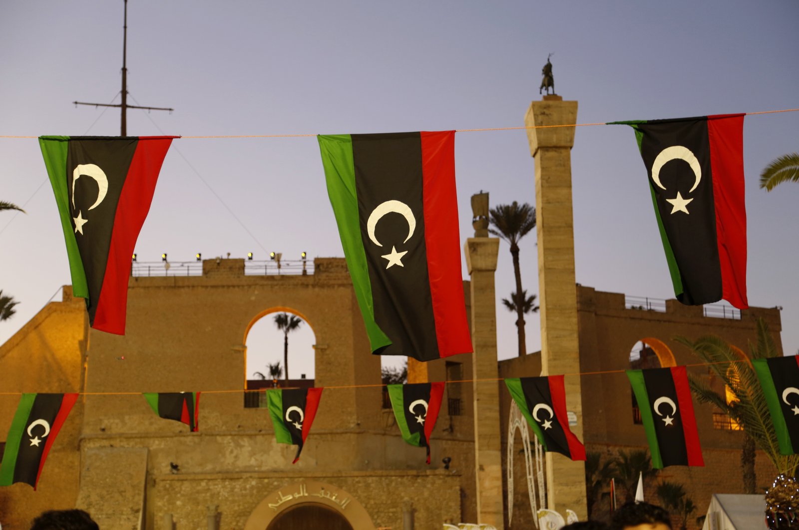 Libyan flags are displayed as people celebrate the February Revolution Day in Martyrs&#039; Square in Tripoli, Libya, Friday, Feb. 18, 2022. (AP File Photo)