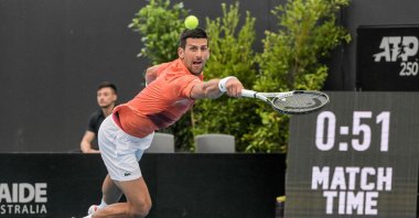 Serbia's Novak Djokovic hits a return against France's Quentin Halys during their men's singles match at the Adelaide International tennis tournament, Adelaide, Australia, Jan. 5, 2023. (AFP Photo)