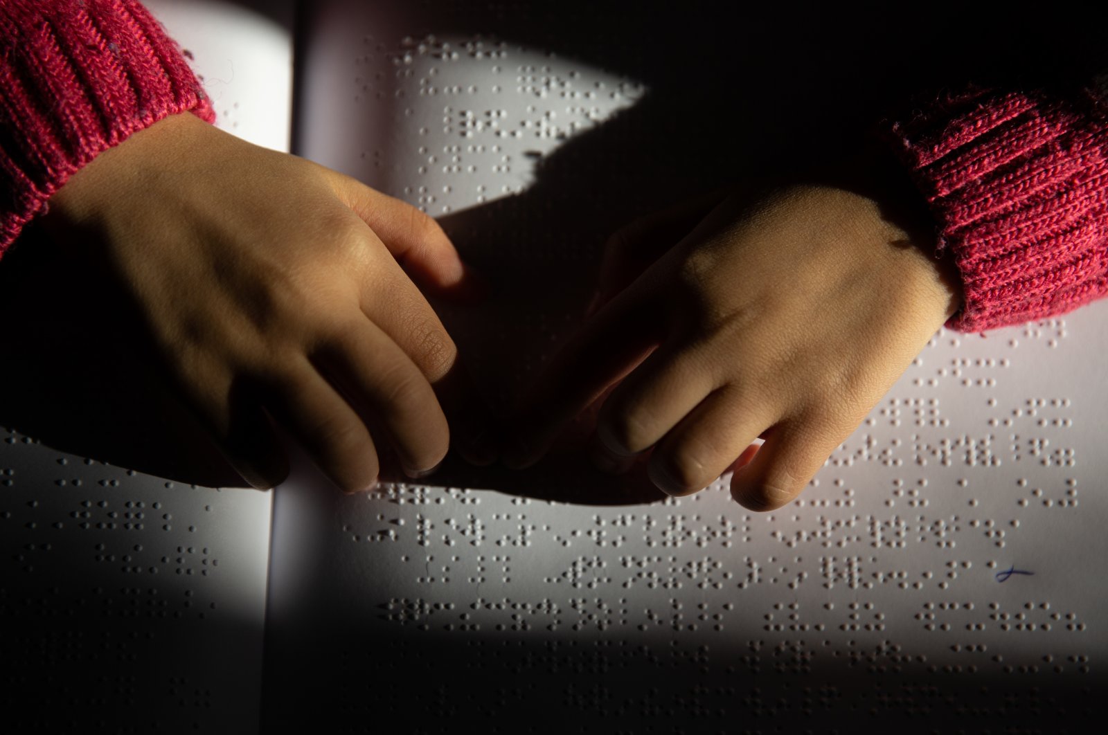 A visually impaired student reads Braille, Ankara, Türkiye, Jan. 4, 2023. (AA Photo)