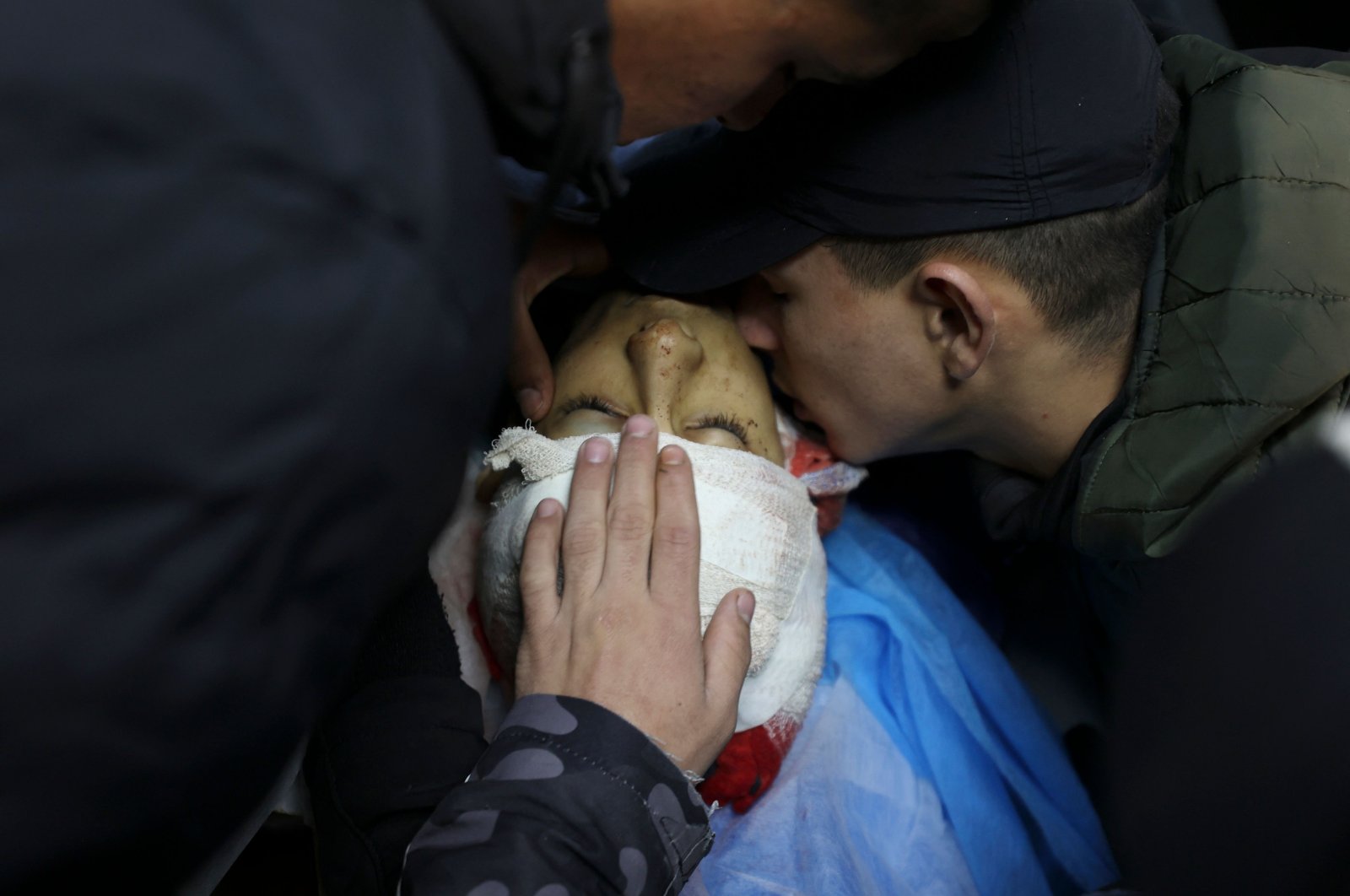 Friends of Palestinian teenager Amer Abu Zeitoun, killed by Israeli forces in an overnight raid in Nablus, bid him farewell, occupied West Bank, Palestine, Jan. 5, 2023. (AFP Photo)