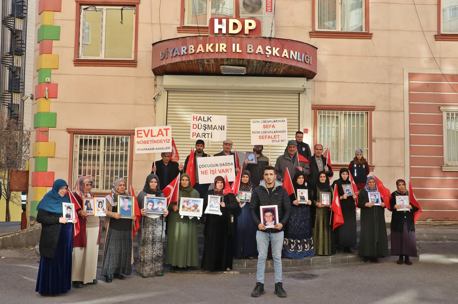 Kurdish families, whose children were abducted by the PKK, protest against the terrorist group and the pro-PKK Peoples&#039; Democratic Party (HDP) in front of the party&#039;s office in southeastern Diyarbakır province, Türkiye, Jan. 3, 2022. (DHA Photo)