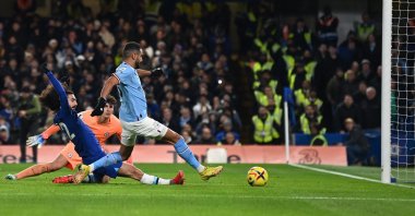 Manchester City's midfielder Riyad Mahrez (R) scores the opening goal during the English Premier League football match between Chelsea and Manchester City at Stamford Bridge, London, Jan. 5, 2023. (AFP Photo)