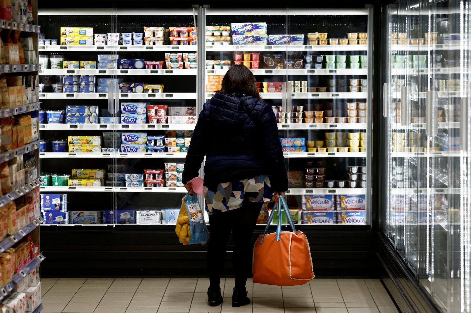 A woman shops in a supermarket in La Verrie, France, Dec. 9, 2022. (Reuters Photo)